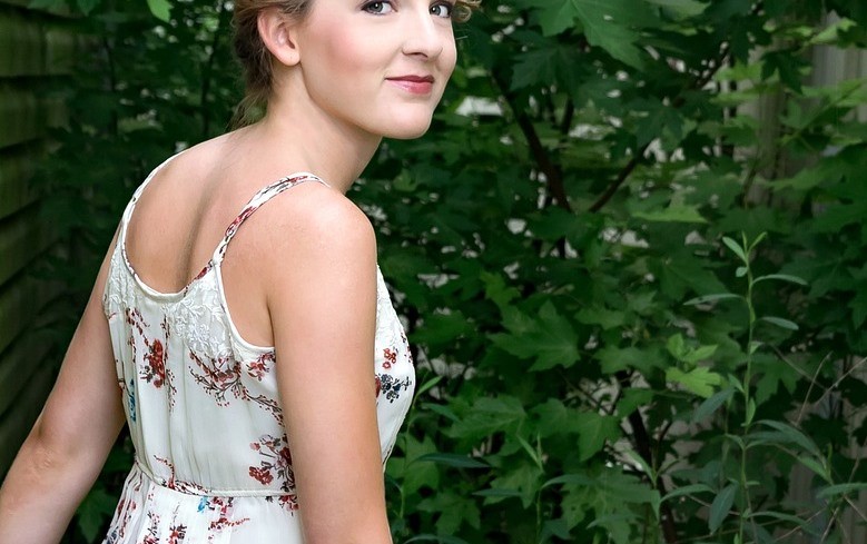 beautiful girl wearing white dress on the woods