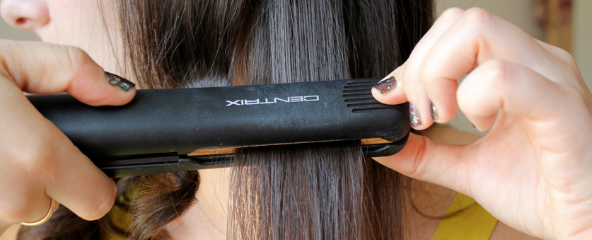 a girl doing hair straightening