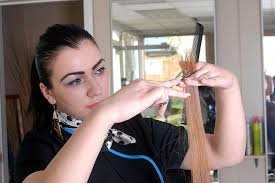 white girl cutting a blonde hair